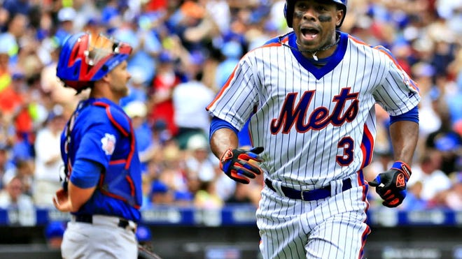 Mets' Curtis Granderson reacts as he crosses the plate after hitting a home run during the first inning against the Chicago Cubs on Sunday, July 3, 2016 in New York.