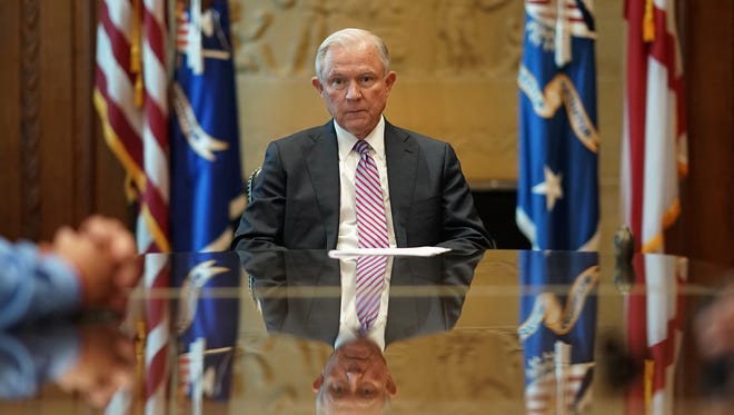 Sessions meets with families of victims killed by illegal immigrants in his office at the Justice Department on June 29, 2017, in Washington.