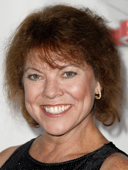 FILE - In this Sept. 24, 2008 file photo, Erin Moran arrives at the Fox Reality Channel Really Awards in Los Angeles. Moran, the former child star who played Joanie Cunningham in the sitcoms "Happy Days" and "Joanie Loves Chachi," has died at age 56. Police in Harrison County, Indiana said that she had been found unresponsive Saturday, April 22, 2017, after authorities received a 911 call. (AP Photo/Matt Sayles, File) ORG XMIT: CAET959