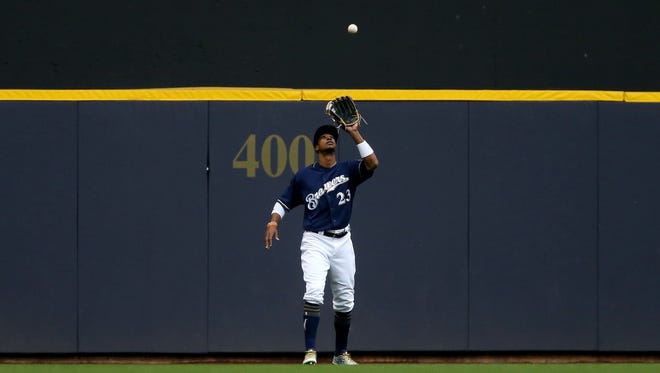 Keon Broxton is camped under a fly ball for an easy out.