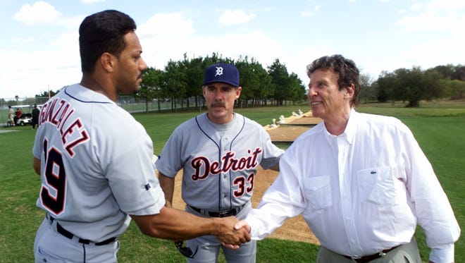New Tigers manager, Phil Garner introduced his new slugger, Juan Gonzalez  to Tigers owner Mike Ilitch in 2000.