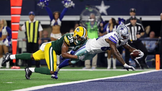 Cowboys wide receiver Dez Bryant (88) catches a touchdown in the fourth quarter against the Packers.
