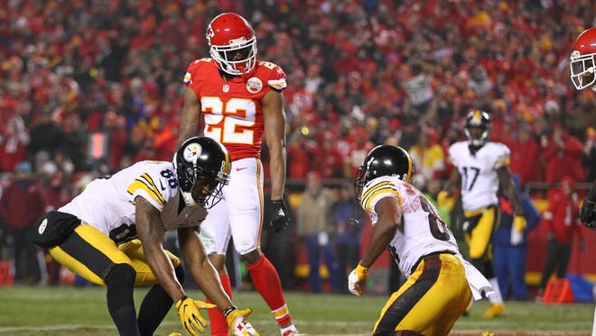 Marcus Peters (22) looks on as a Steelers pass falls incomplete.