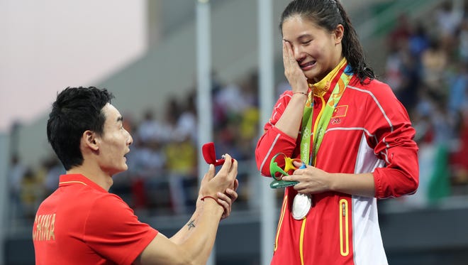 Zi He (CHN) wins silver and receives a proposal after the women's 3m springboard final in the Rio 2016 Summer Olympic Games at Maria Lenk Aquatics Centre.