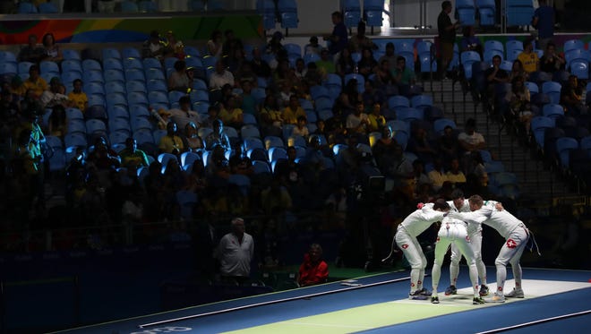 Team France comes together before competing against Spain in the men's epee team event at Carioca Arena 3 during the Rio 2016 Summer Olympic Games.