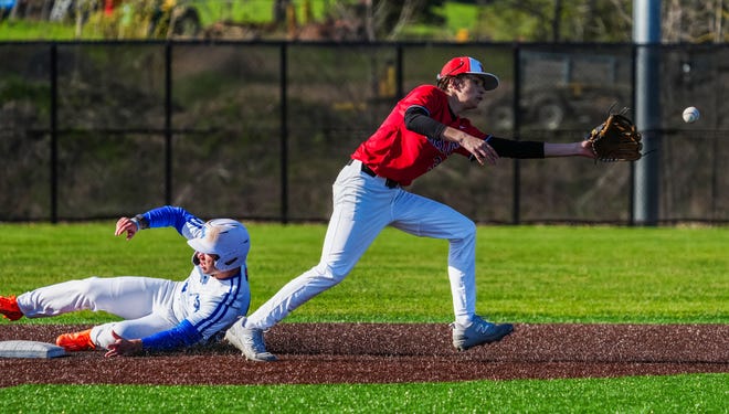 Oak Creek's Cade Palkowski (42) steals second as Racine Horlick's Connor Blaeske (3) waits on the throw during the game at Oak Creek, Friday, April 19, 2024.