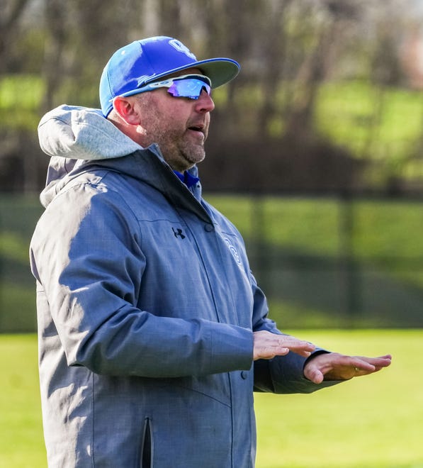 Oak Creek head coach Scott Holler gestures from the sideline during the game at home against Racine Horlick, Friday, April 19, 2024. Oak Creek won 7-0.