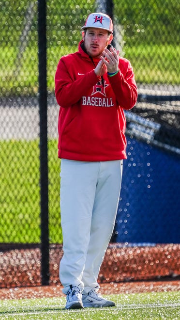 Racine Horlick head coach Tyler Funk applauds a play during the game at Oak Creek, Friday, April 19, 2024.
