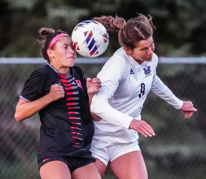 Muskego's Amanda Pankiewicz, left, and Waunakee's Claire Jaeger (9) battle for a header during the match at Muskego, Friday, April 19, 2024.