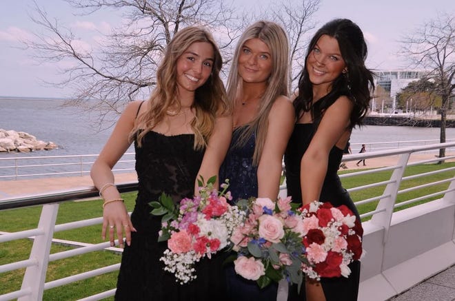 Arrowhead High School students (from left) Kylie Peterson, Kate Ahearn and Kylie Adams pose for a prom photo on Saturday, April 27, 2024, at the Milwaukee Art Museum before heading to the dance at the Brookfield Conference Center.