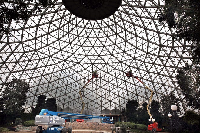 Workers install stainless steel mesh inside the Show Dome at the Mitchell Park Domes Horticulture Conservatory in March 2016.