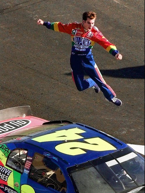 Gordon jumps from the roof of his car after winning his second career Winston Cup Championship on Nov. 16, 1997. Gordon won 10 Cup races for the second consecutive year.