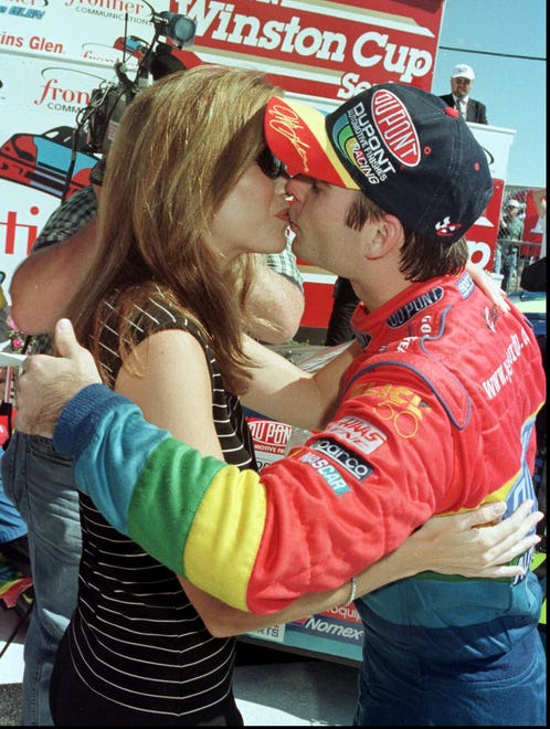 Gordon gets a kiss from his then-wife, Brooke Sealy after winning the Frontier at The Glen on Aug. 15, 1999. Gordon won seven races and finished sixth in the standings.