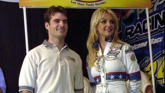 Gordon poses with singer Britney Spears before the Pepsi 400 at Daytona International Speedway on July 7, 2001.
