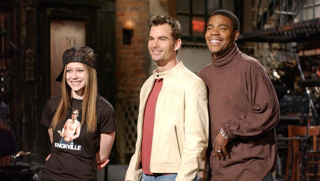 Gordon, center, rehearses for his stint as host of Saturday Night Live on Jan. 9, 2003, with cast member Tracy Morgan, right, and musical guest Avril Lavigne, left.