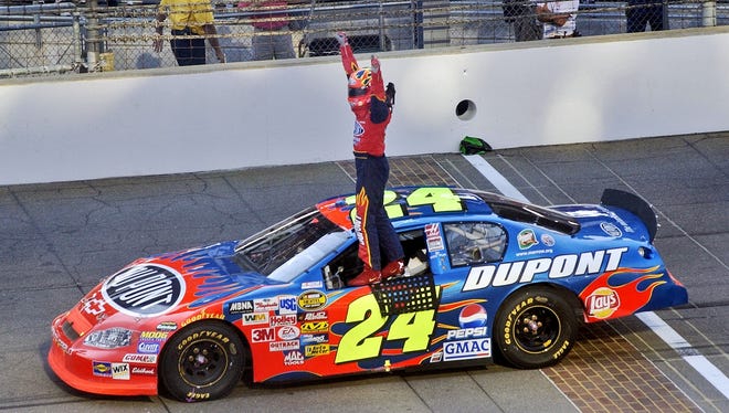 Gordon celebrates after winning the Brickyard 400 on Aug. 8, 2004. It marked the fourth time that Gordon had won the NASCAR race at Indianapolis Motor Speedway.
