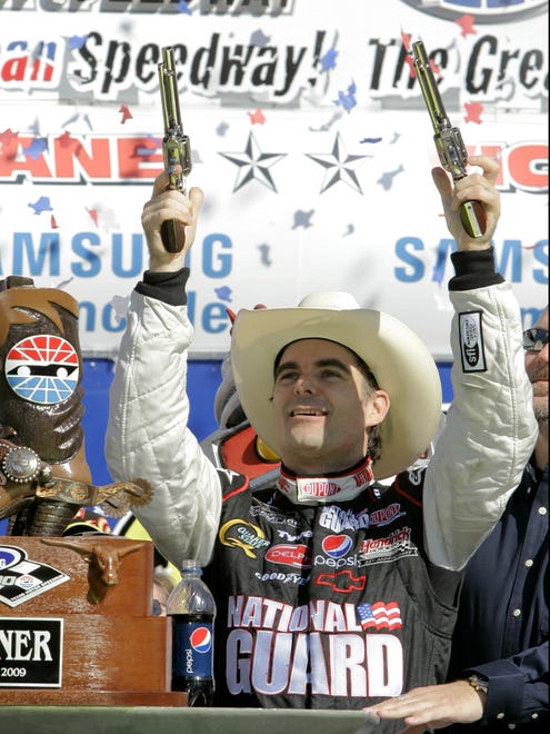 Gordon celebrates in victory lane with a pair of pistols after winning the Samsung 500 at Texas Motor Speedway on April 5, 2009. It was Gordon's lone victory of the season. He finished third in the Sprint Cup standings.