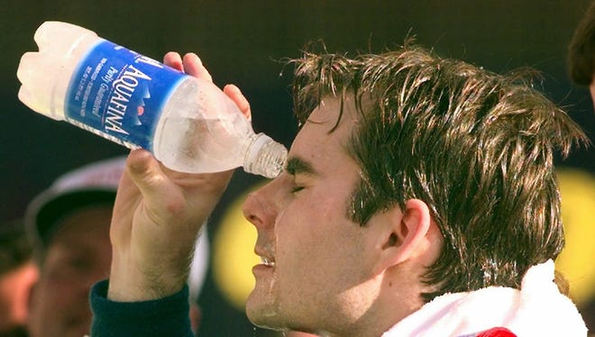 Gordon cools off after winning the Food City 500 at Bristol Motor Speedway for the fourth consecutive year on March 29, 1997.