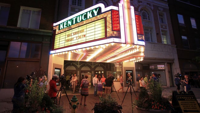 Moviegoers leave the Kentucky Theatre in Lexington, Ky., after viewing the documentary "Sole Survivor" on Thursday, July 18, 2013.