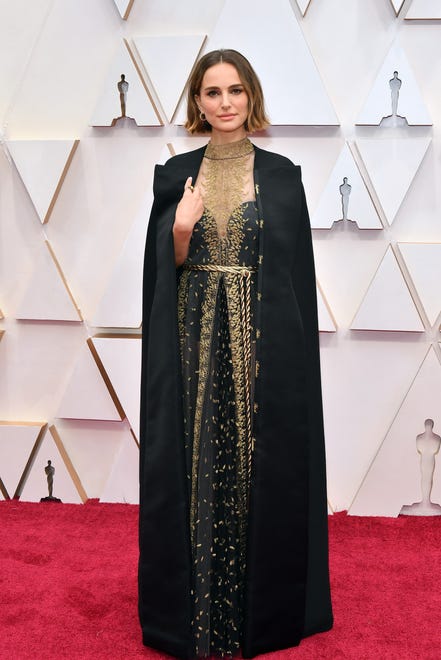 Portman made headlines with her statement Dior gown at the 92nd annual Academy Awards on Feb. 9, 2020. Her black and gold ensemble featured a cape embroidered with the names of the female directors who weren ' t nominated for an Oscar.